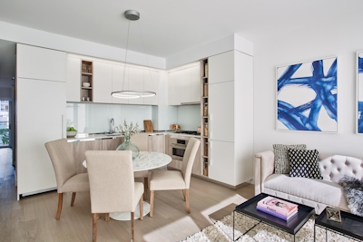 a living room filled with furniture and a large window