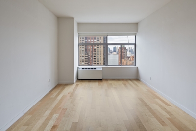 a large empty room with a wooden floor