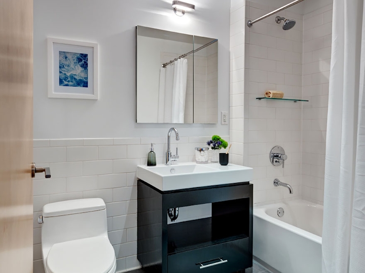 a room with a sink and a mirror