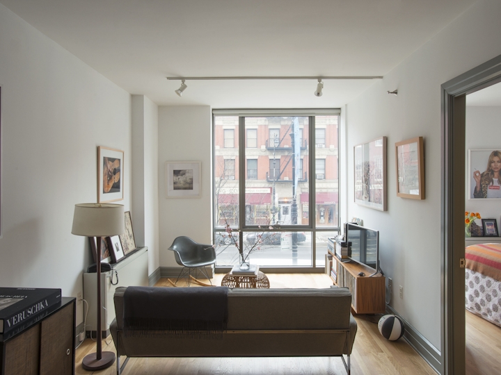 a living room filled with furniture and a flat screen tv