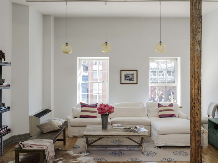 a living room filled with furniture and a fireplace