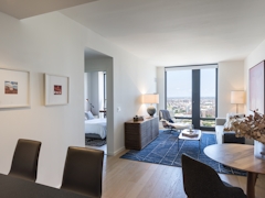 Thumbnail of The Ashland: 38N a living room filled with furniture and a large window