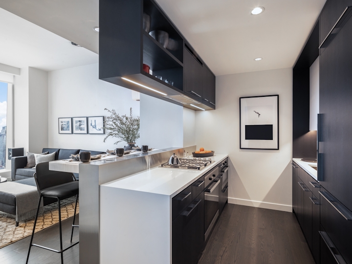 a modern kitchen with an island in the middle of a room