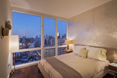 a bedroom with a large bed in a hotel room