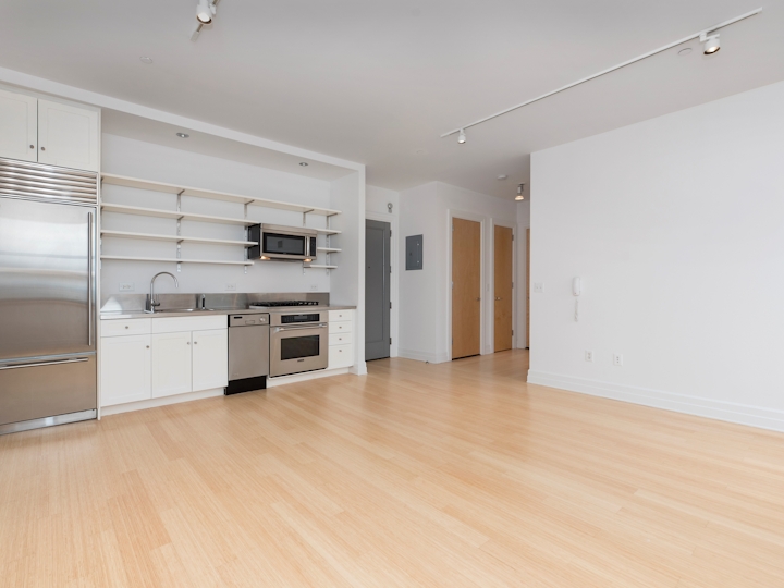 a kitchen with a wood floor
