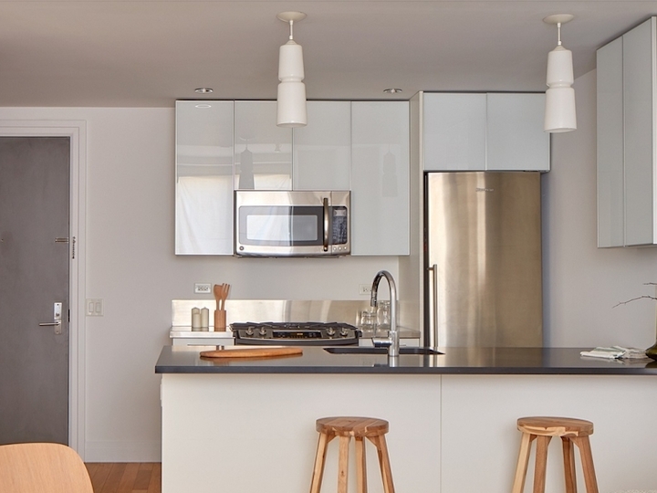 a kitchen with a table in a room