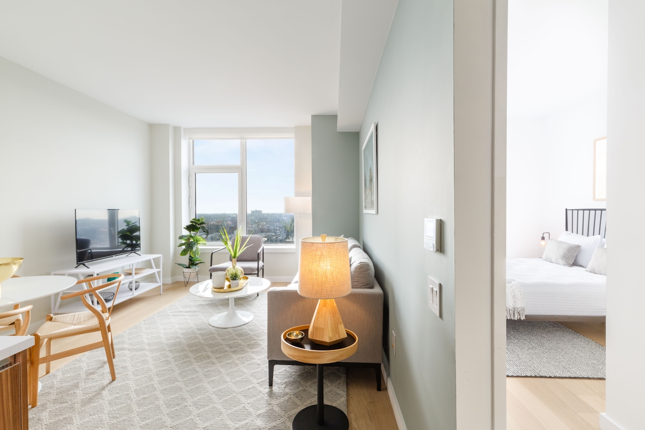 a room filled with furniture and a large window