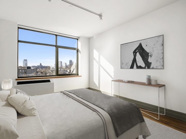 a bedroom with a large bed in a hotel room