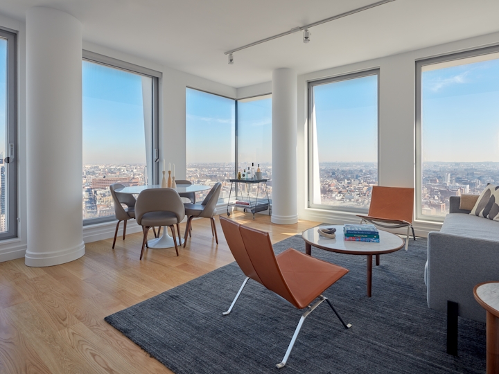 a living room filled with furniture and a large window