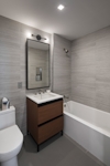 a room with a sink and a mirror