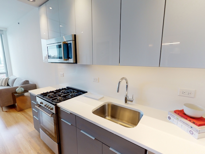 a kitchen with a sink and a microwave