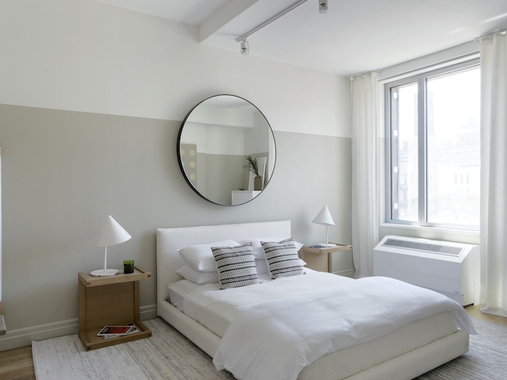 a bedroom with a large bed in a room