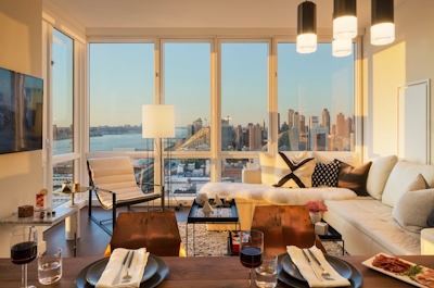 a living room filled with furniture and a large window