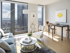 Thumbnail of The Ashland: 38G a living room filled with furniture and a large window