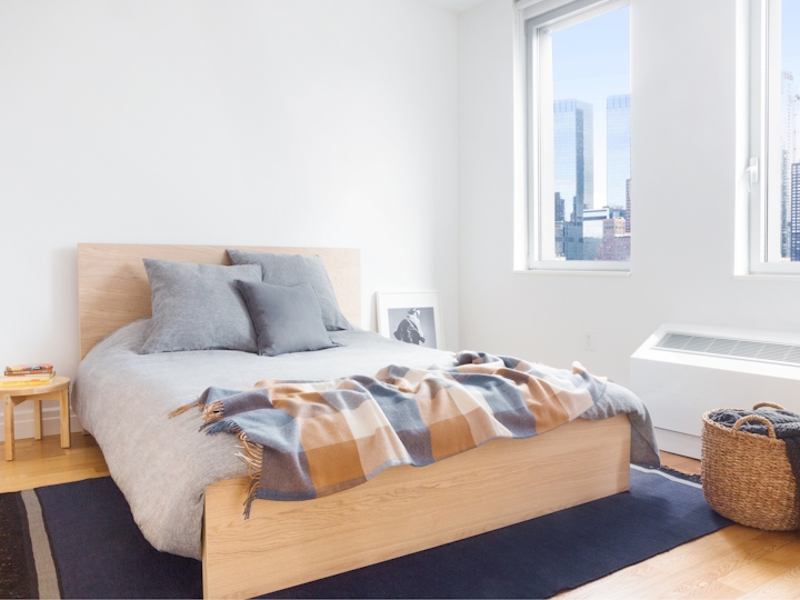 a bedroom with a large window