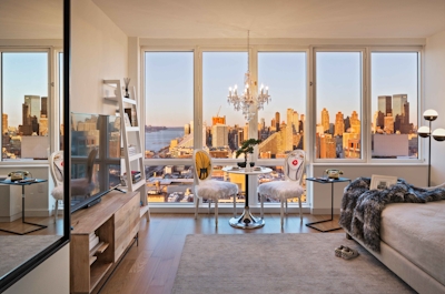 a room filled with furniture and a large window