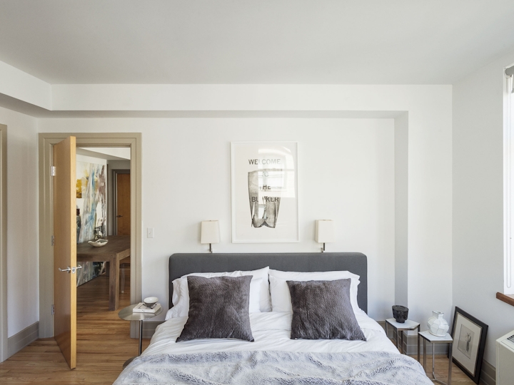 a bedroom with a bed in a room
