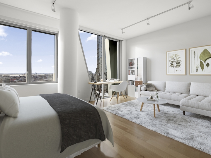 a bedroom with a bed and a large window