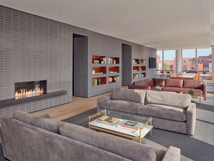 a living room filled with furniture and a large window