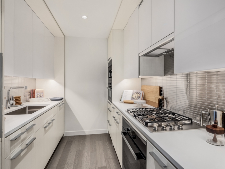 a kitchen with a stove sink and refrigerator