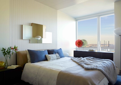 a bedroom with a large bed in a hotel room
