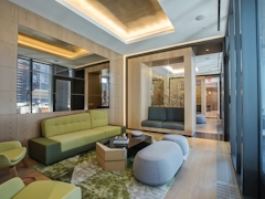 Thumbnail of The Ashland: 38G a living room filled with furniture and a large window