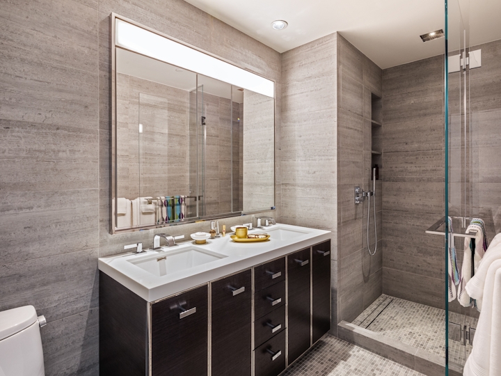 a large white tub next to a glass shower door