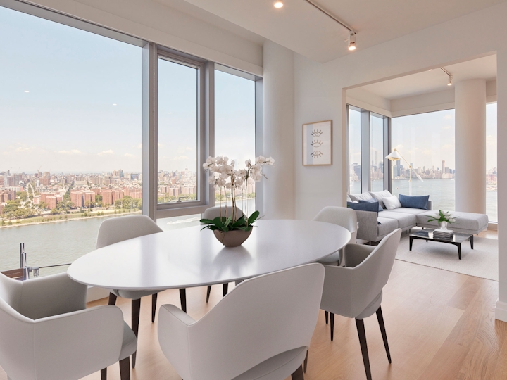 a dining room table in front of a window