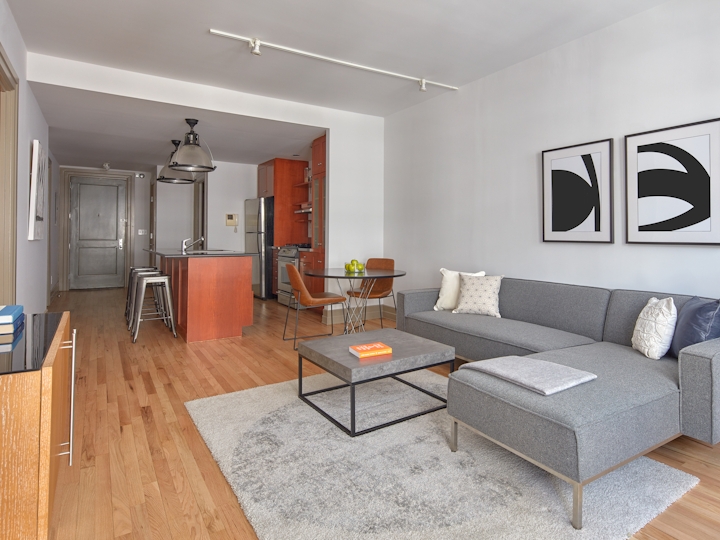 a living room filled with furniture and a fireplace