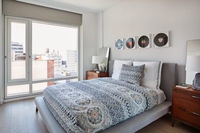 a bedroom with a bed and window in a room