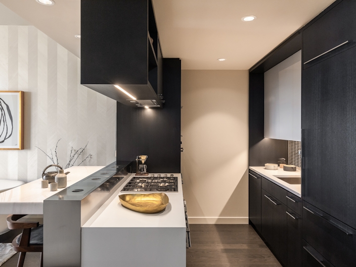 a kitchen with a sink and a mirror