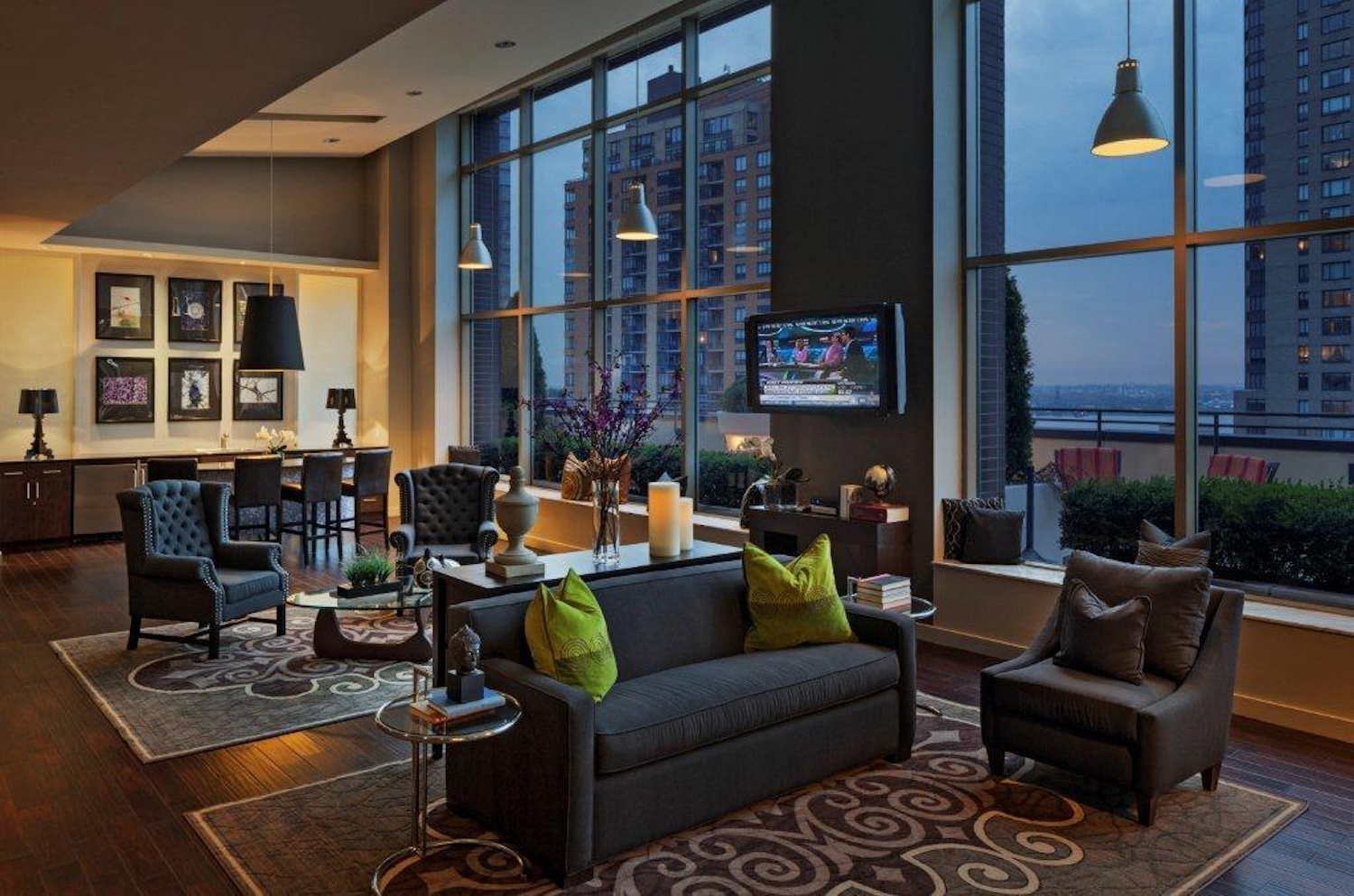a living room filled with furniture and a large window