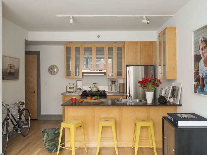 a kitchen filled with lots of furniture