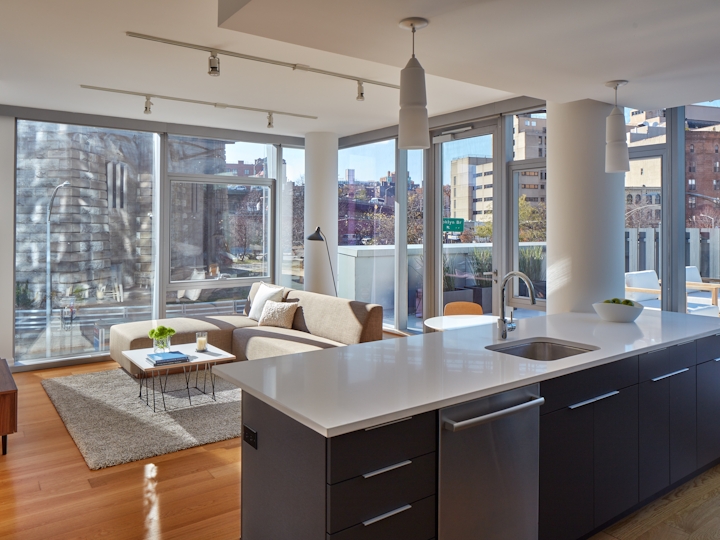a room filled with furniture and a large window