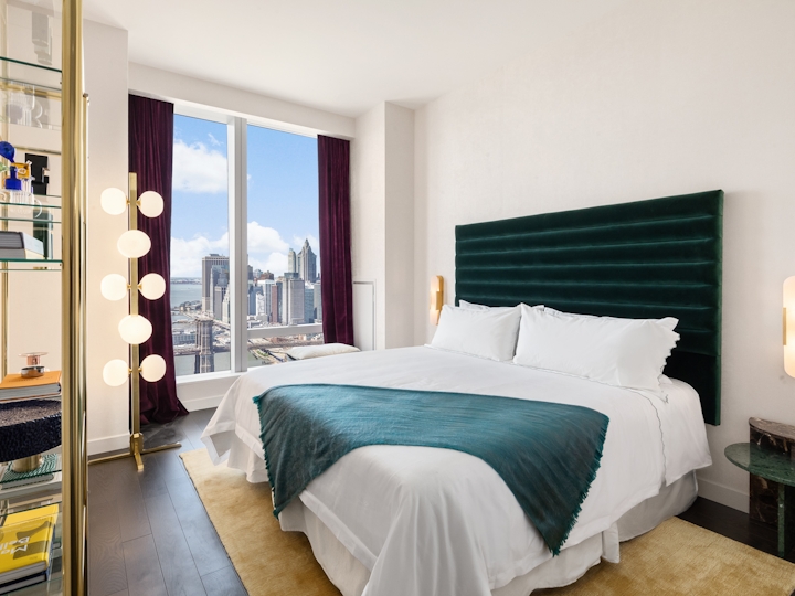 a bedroom with a large bed in a hotel room