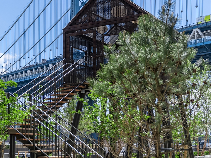 a bridge over a metal fence
