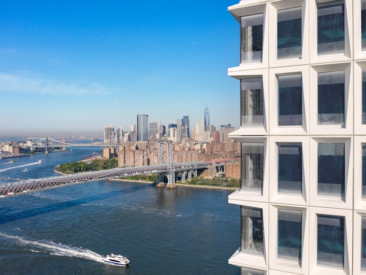 a building next to a body of water