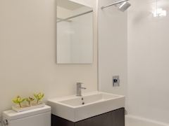 Thumbnail of Atlas New York: 33F a white sink sitting under a mirror