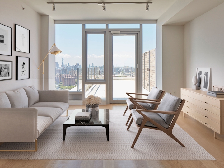 a living room filled with furniture and a large window