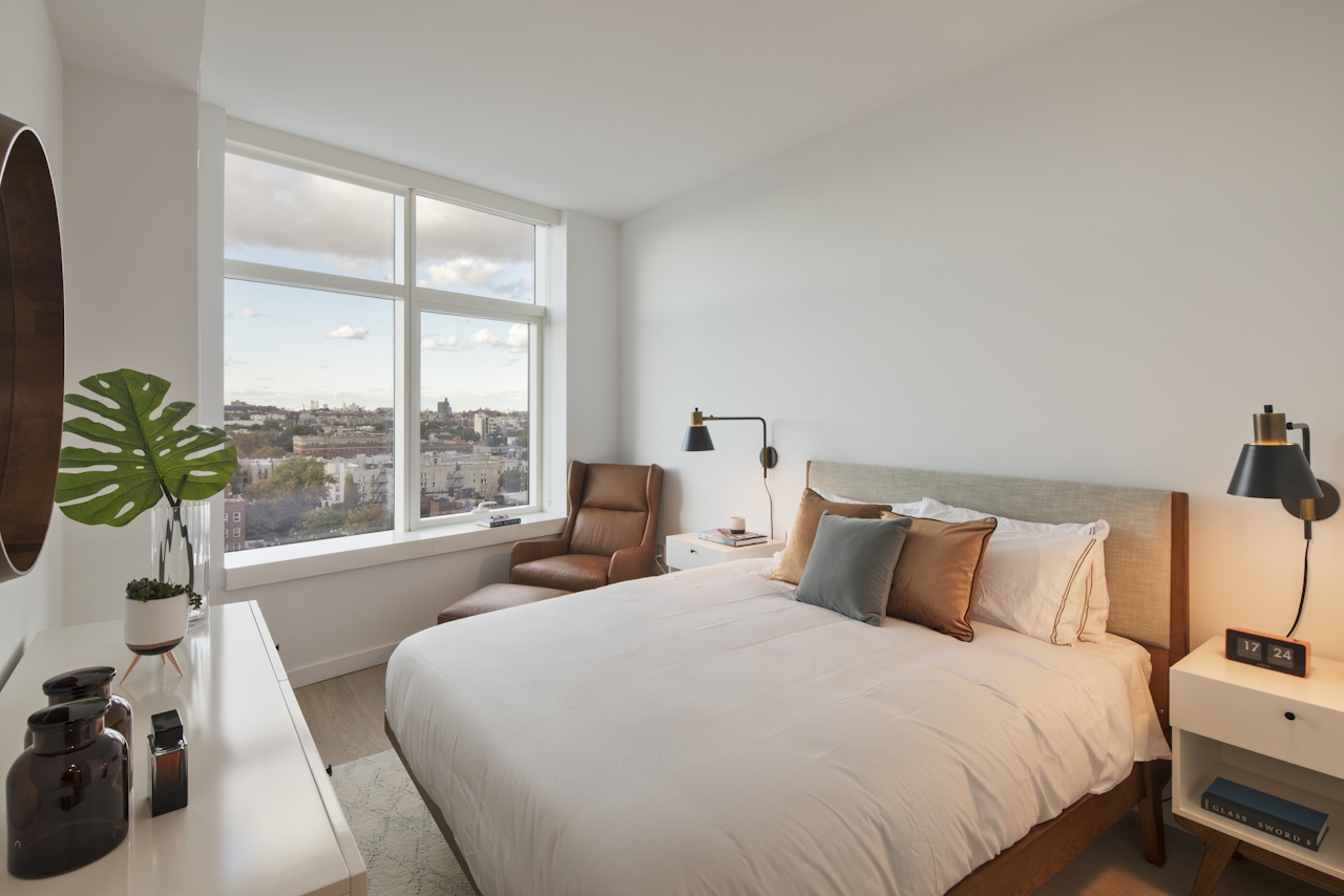 a bedroom with a large bed in a hotel room