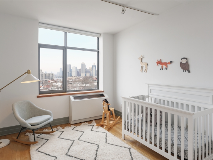 a bedroom with a large window