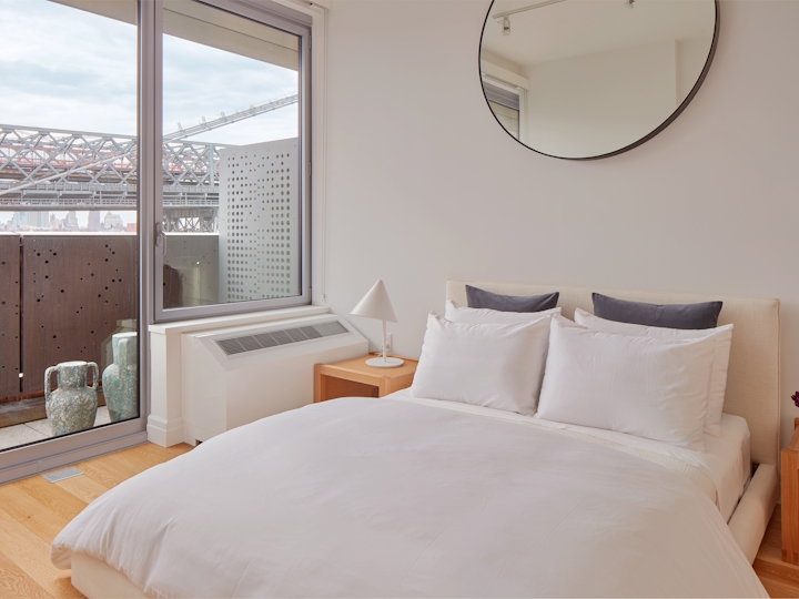 a bedroom with a large bed in a hotel room