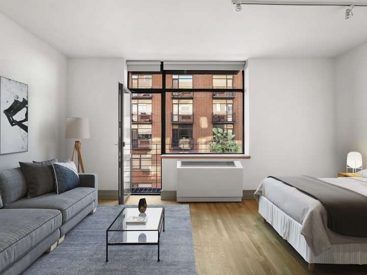 a living room filled with furniture and a large window