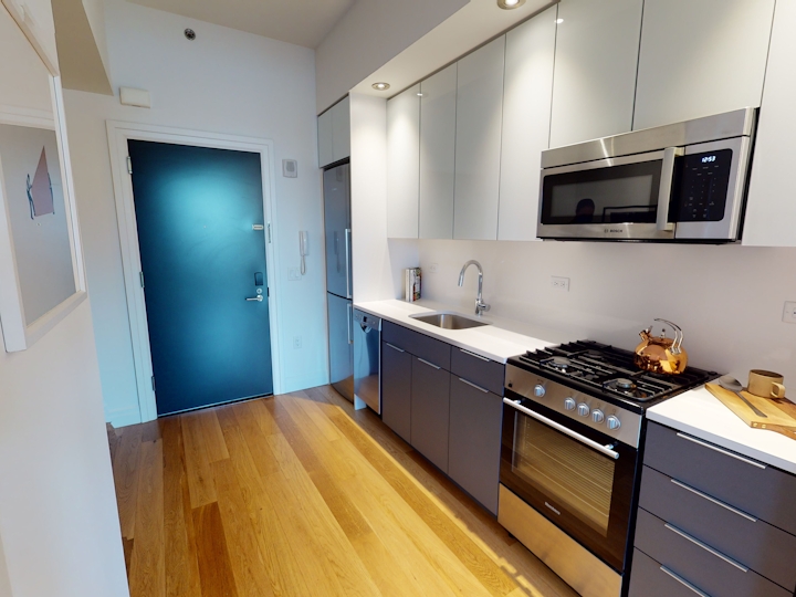 a kitchen with a sink and a microwave