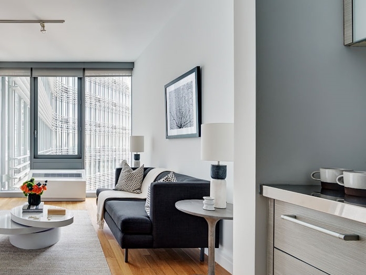 a living room with a sink and a window