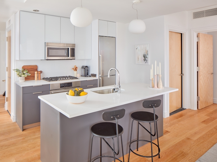a kitchen with a table in a room