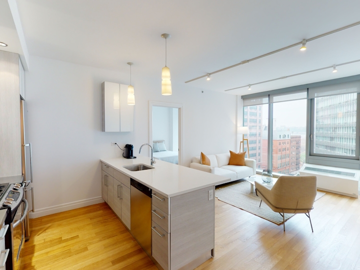 a room filled with furniture and a large window