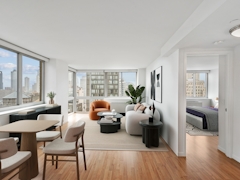 Thumbnail of Atlas New York: 22D a view of a living room filled with furniture and a large window