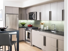 Thumbnail of The Ashland: 41P a kitchen with an island in the middle of a room