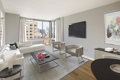 a living room filled with furniture and a large window